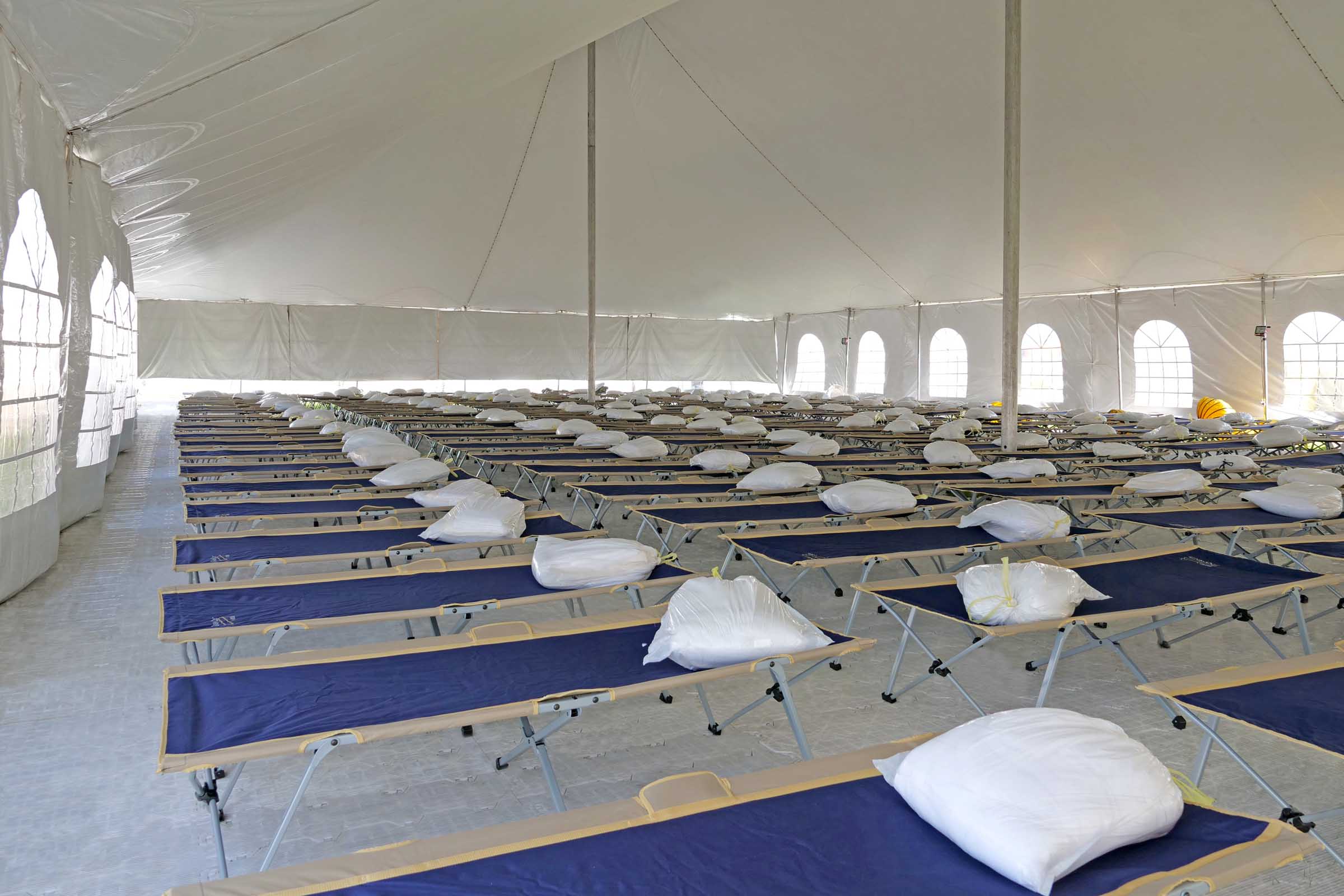 Sleep tent interior image with multiple cots for crew.