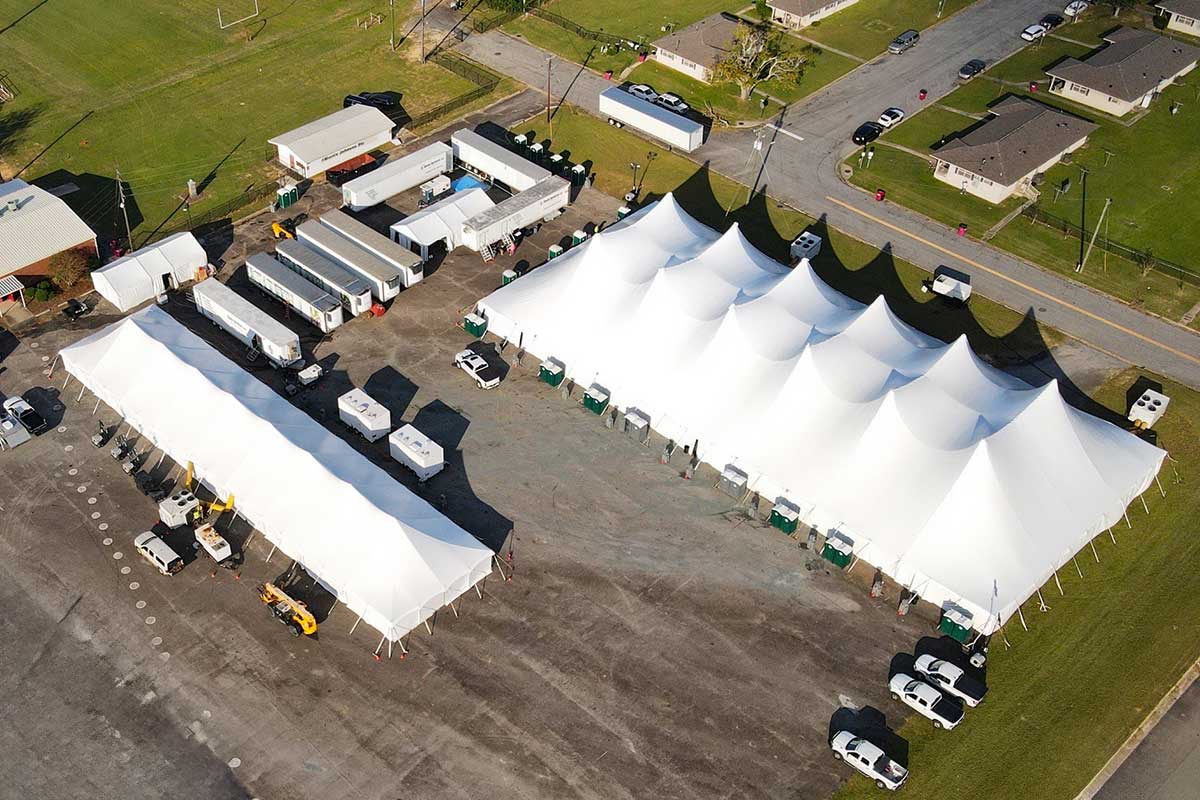 Sleep tents deployed at a base camp post-storm.