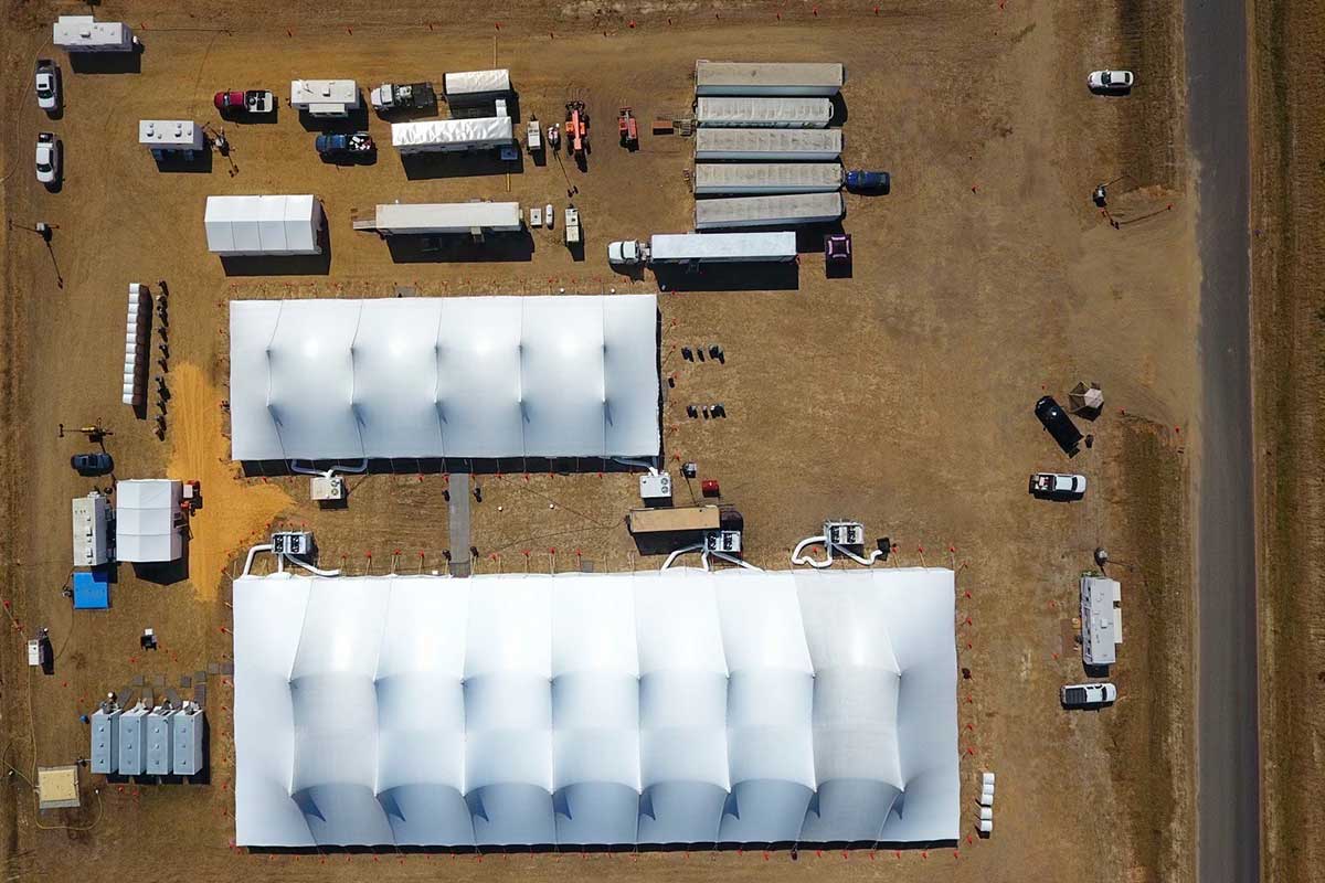 Sleep tents deployed at a base camp.